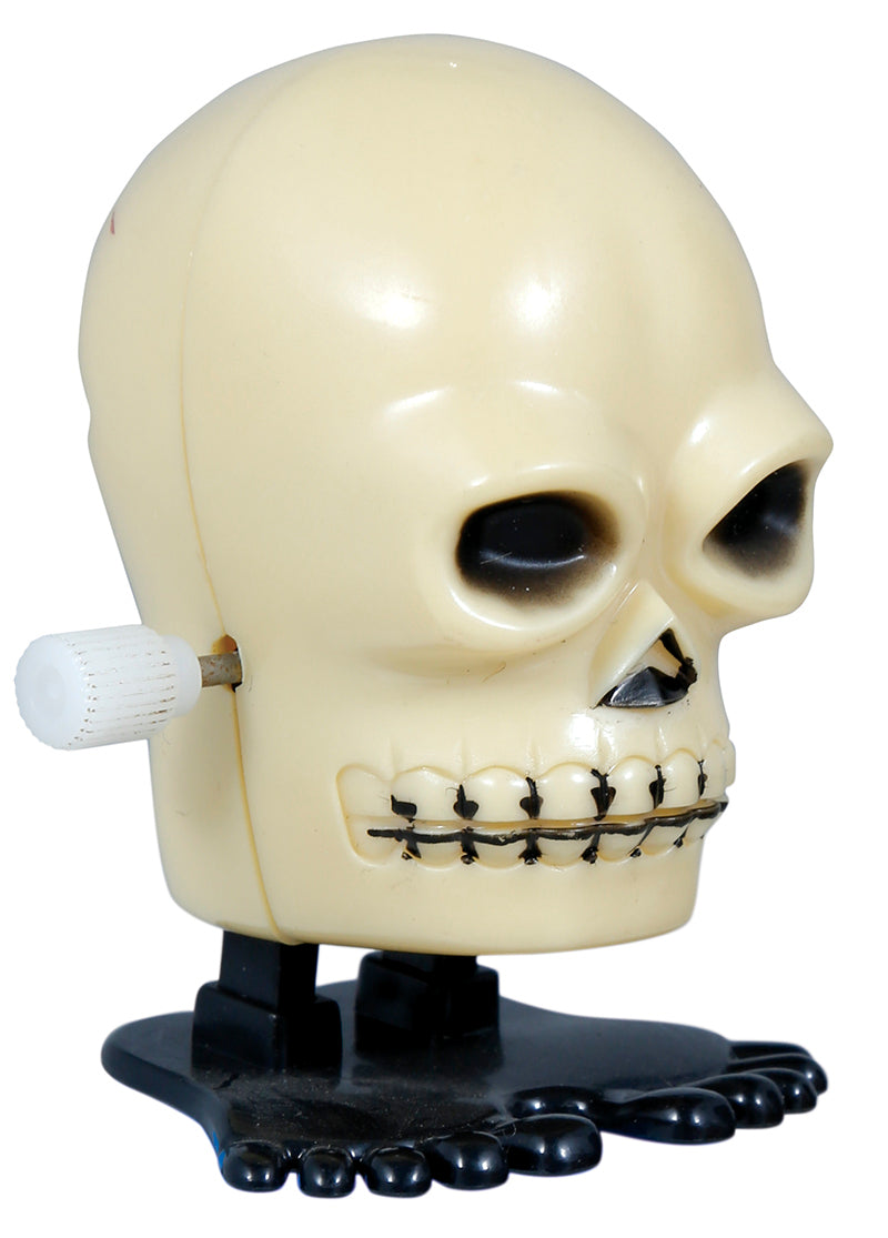 BOX 12 WIND-UP WALKING SKULL, 5 CM